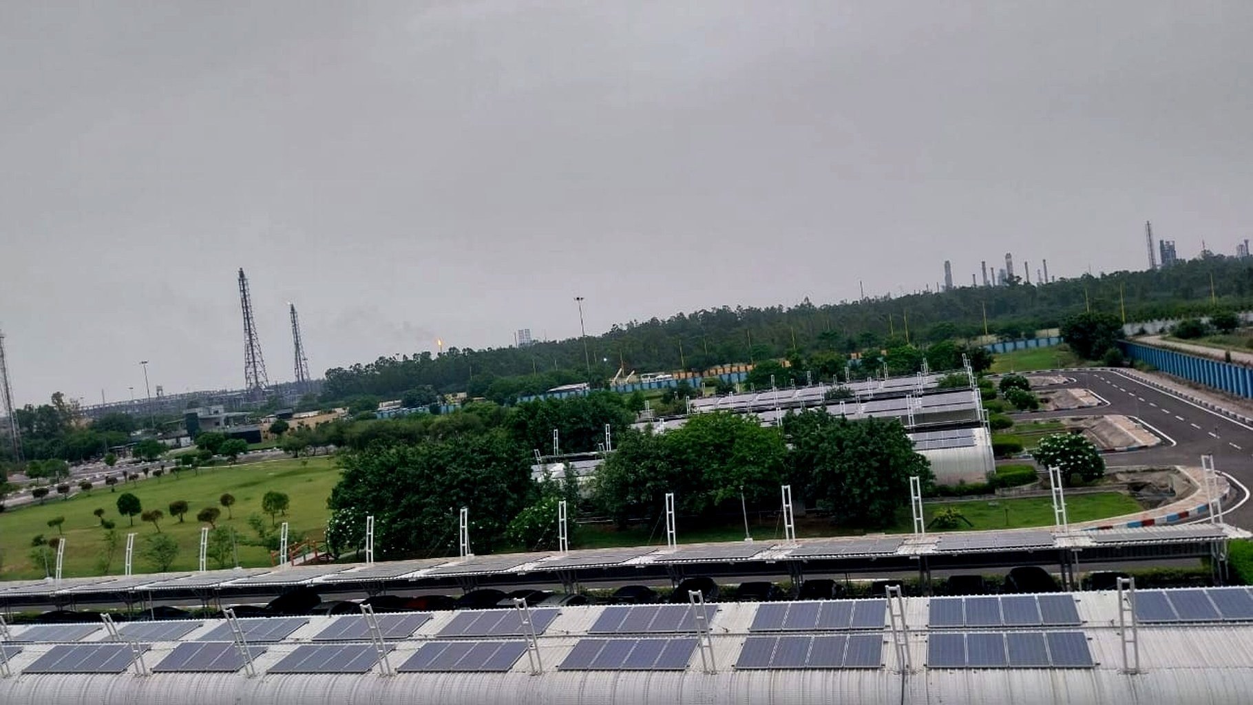 Tin-shed warehouse rooftop solar installation with PV array geometry visible