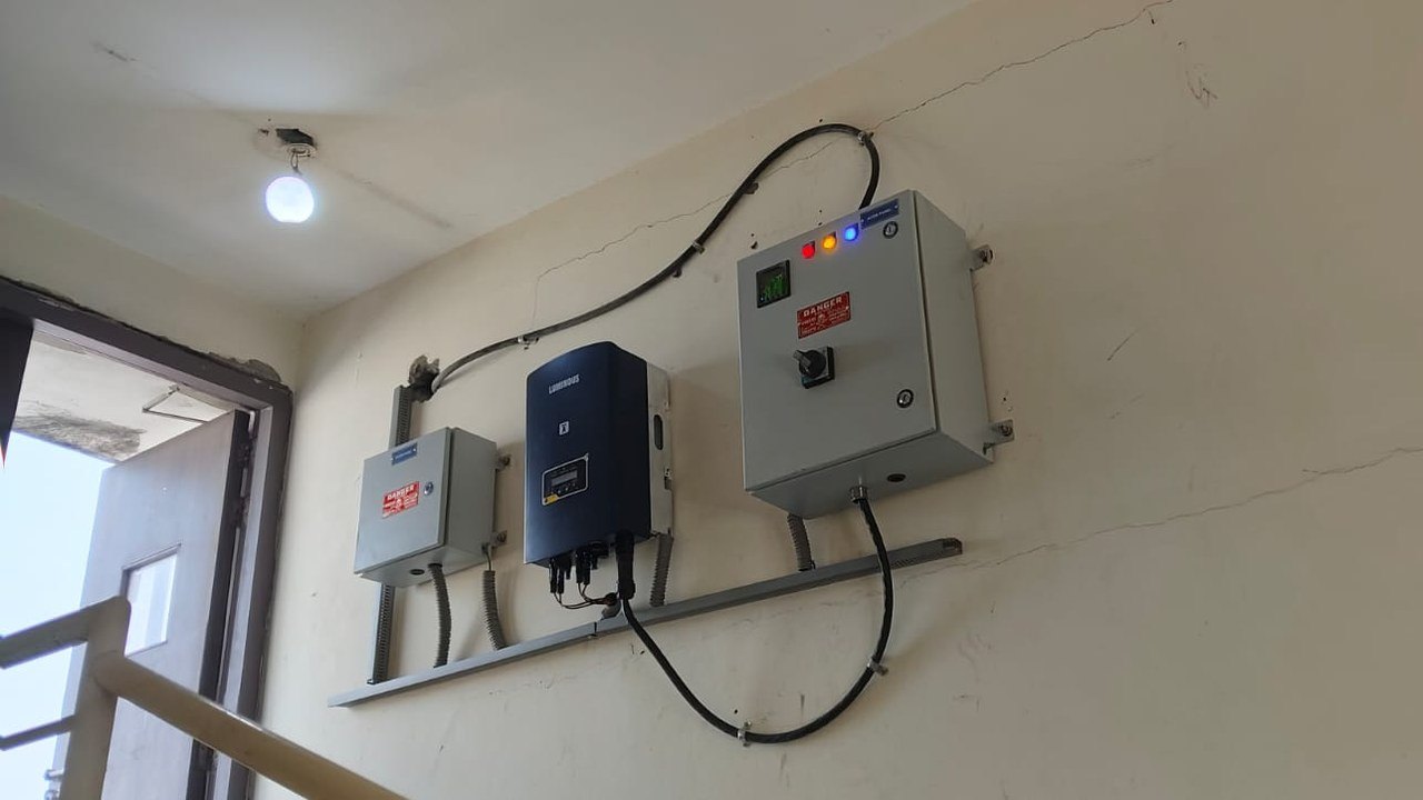Luminous grid tie inverter with DC and AC distribution boxes mounted in a hostel stairwell at AIIMS New Delhi, Masjid Moth