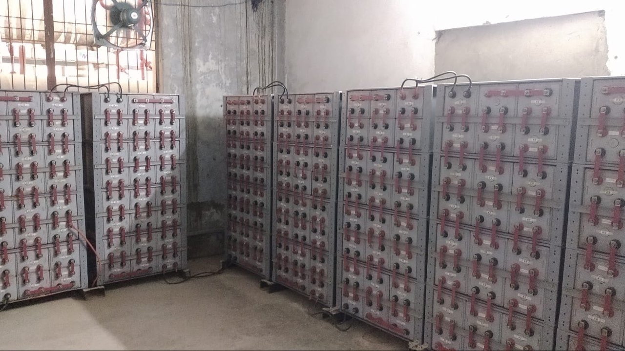 Racks of 2 V gel battery cells forming the 600 kWh battery bank at Kapil Muni Agro Foods, Bewar, Mainpuri