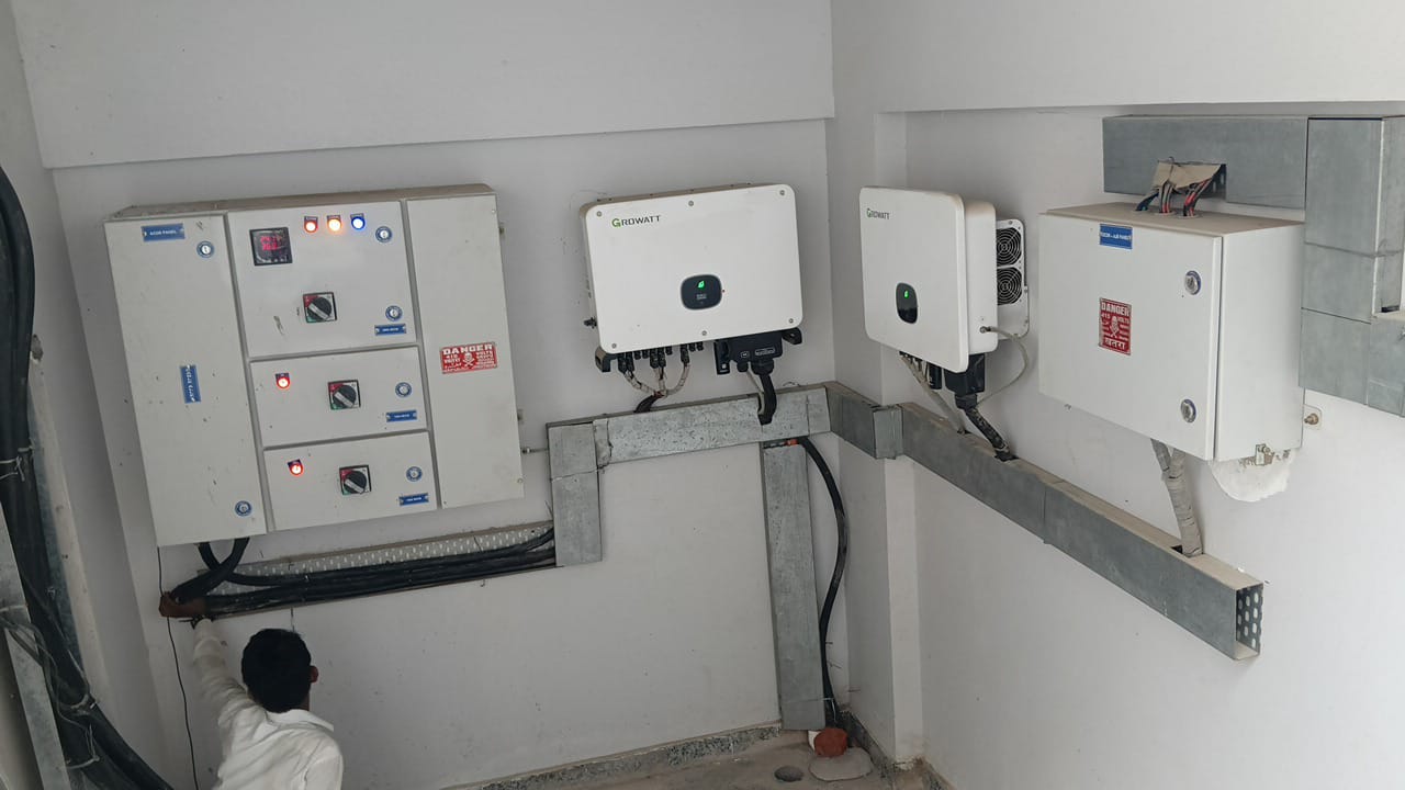 Growatt 50 kW and 35 kW grid tie inverters with AC distribution panel in the solar electrical room at Steadfast Limited, Noida